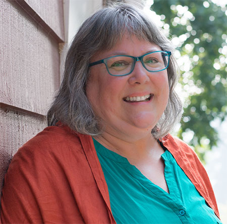 Headshot of former CFSC staff person Meredith Egan smiling at the camera