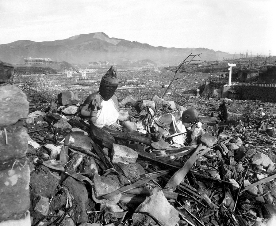 Religious statues from a destroyed temple look over rubble in Nagasaki, Japan, 1945. Photo: Lynn P. Walker, Jr.