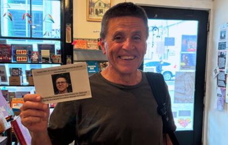 Hassan Diab holding a postcard to the Prime Minister about his case. Photo: Hassan Diab support committee
